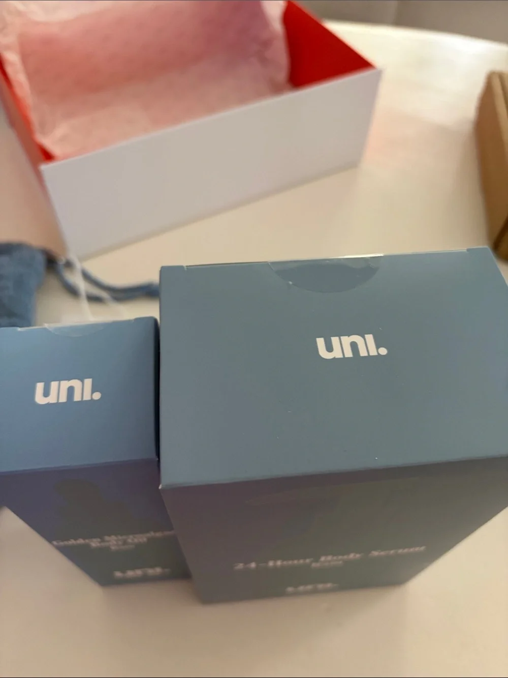 UNI rain body serum and body oil